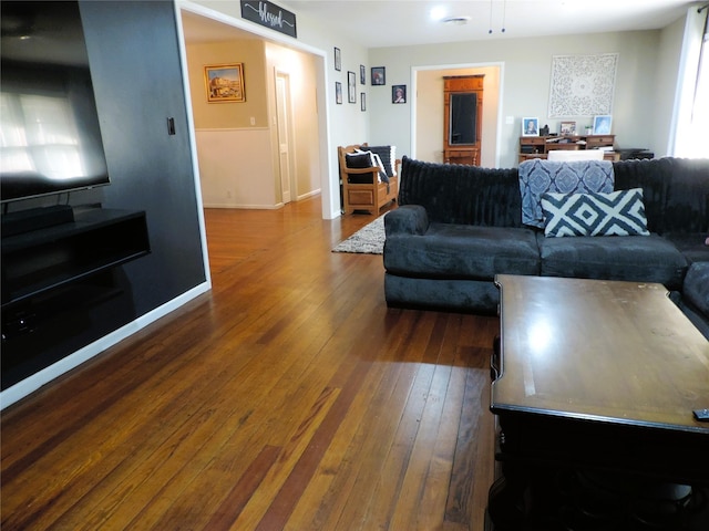 living room featuring dark hardwood / wood-style flooring