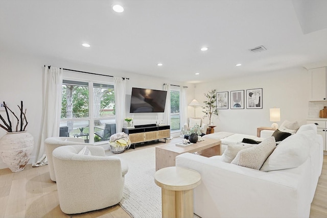 living room with light hardwood / wood-style floors