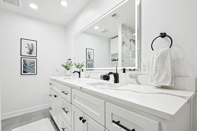 bathroom featuring vanity and a shower with shower door