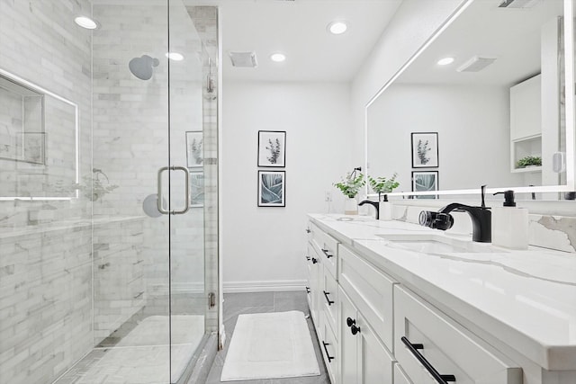 bathroom with an enclosed shower and vanity