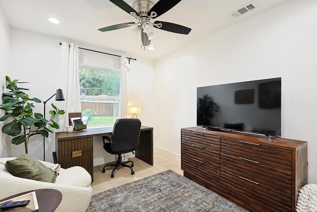 home office featuring ceiling fan and light hardwood / wood-style floors