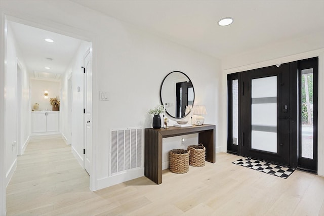 entrance foyer with light hardwood / wood-style flooring