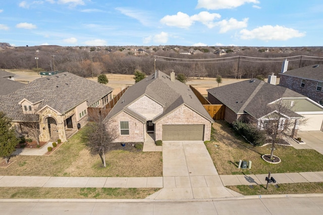 birds eye view of property with a residential view