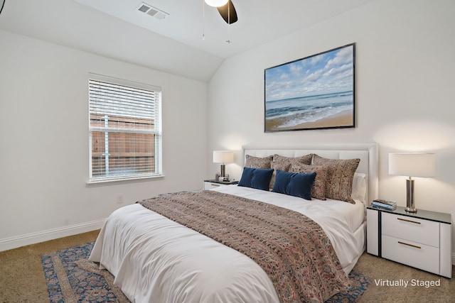 bedroom featuring lofted ceiling, ceiling fan, carpet flooring, visible vents, and baseboards