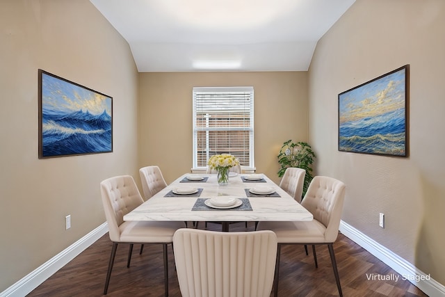 dining space with lofted ceiling, dark wood-style flooring, and baseboards