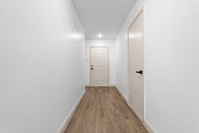 corridor featuring light hardwood / wood-style flooring