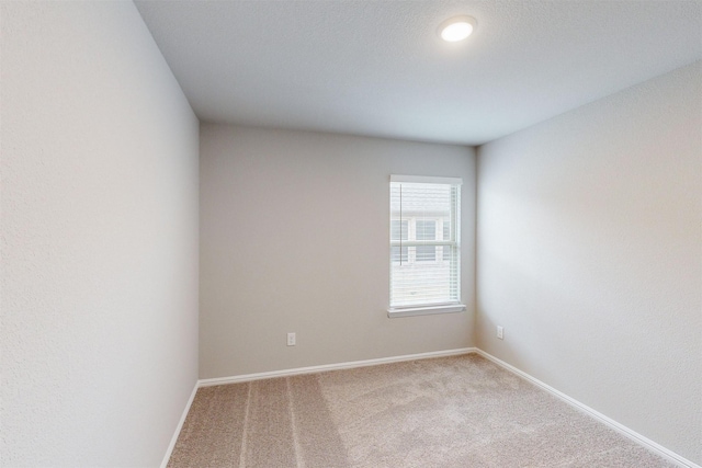 unfurnished room featuring carpet flooring