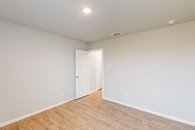 unfurnished room featuring light hardwood / wood-style flooring