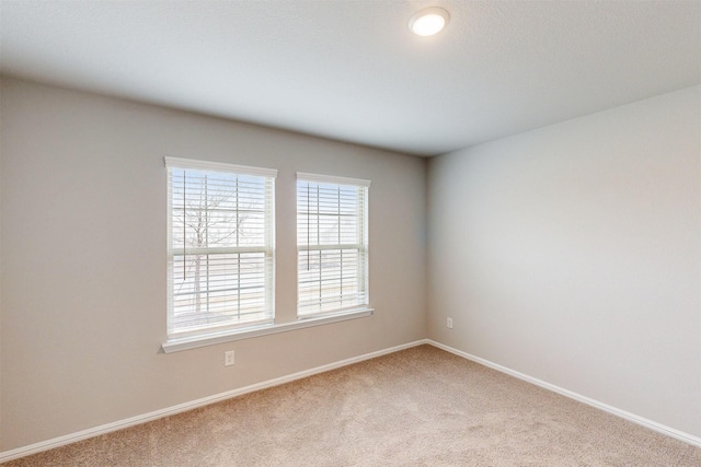 unfurnished room featuring carpet flooring