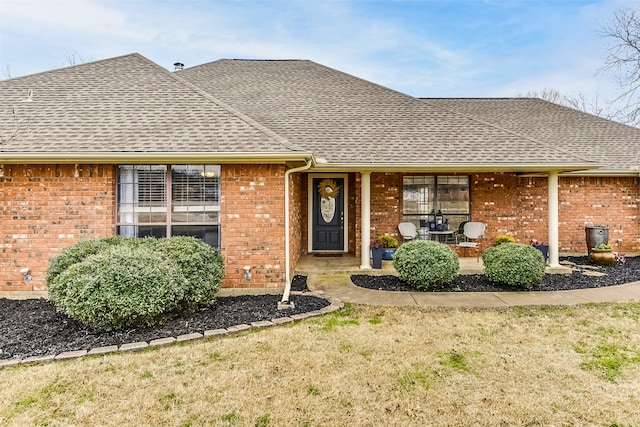 view of front of home with a front yard and a porch