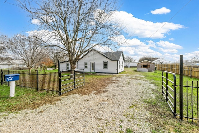 view of home's exterior with an outbuilding and a lawn