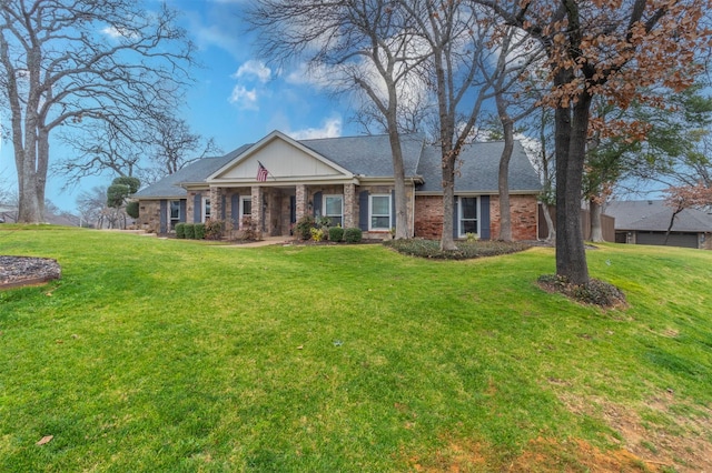 ranch-style home featuring a front yard