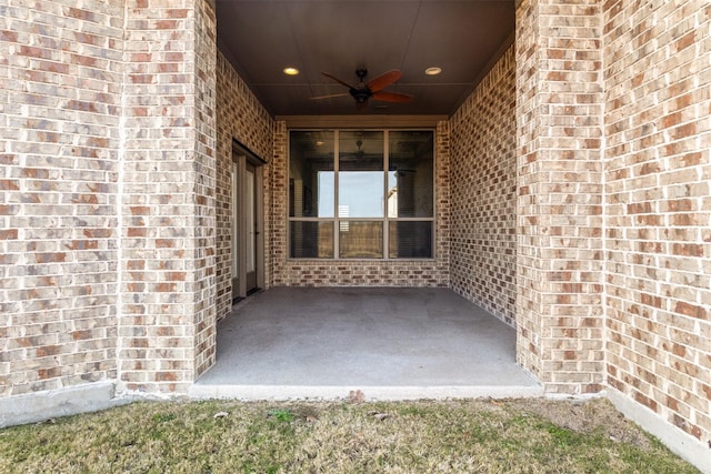 doorway to property featuring a patio and ceiling fan