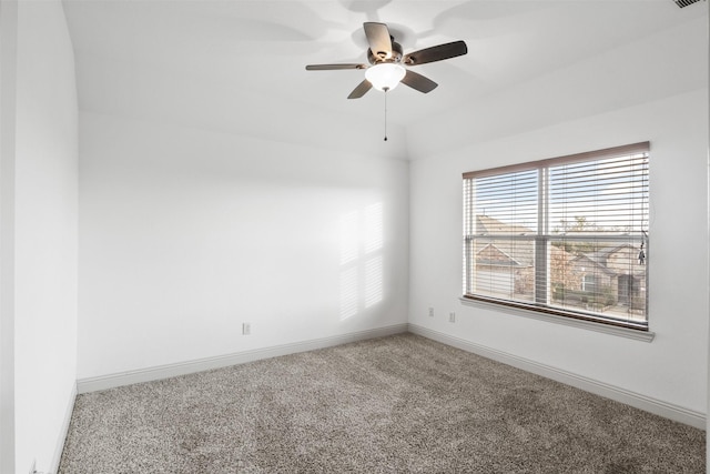 carpeted empty room featuring ceiling fan