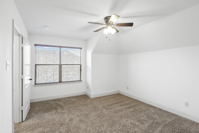 additional living space with light carpet, vaulted ceiling, and ceiling fan