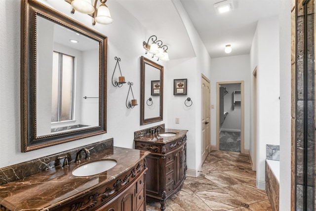 bathroom featuring vanity and a bath