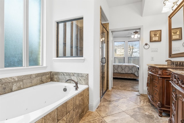 bathroom with independent shower and bath and vanity