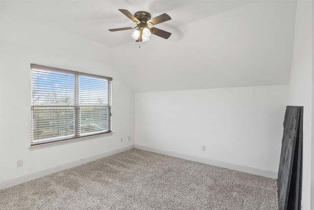 bonus room with light carpet, lofted ceiling, and ceiling fan