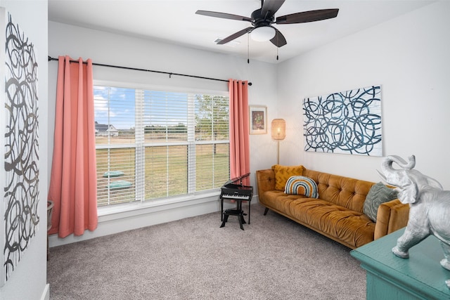 living room featuring ceiling fan and carpet floors