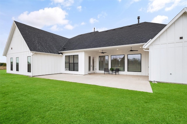 rear view of property featuring ceiling fan, a patio, and a lawn