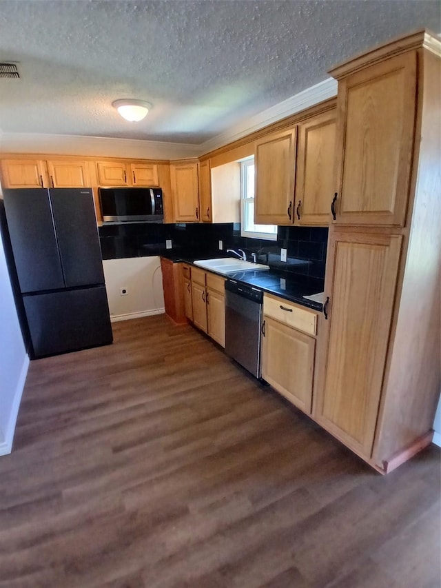 kitchen featuring light brown cabinetry, sink, a textured ceiling, dark hardwood / wood-style floors, and black appliances