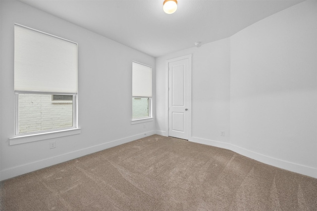 spare room with carpet floors