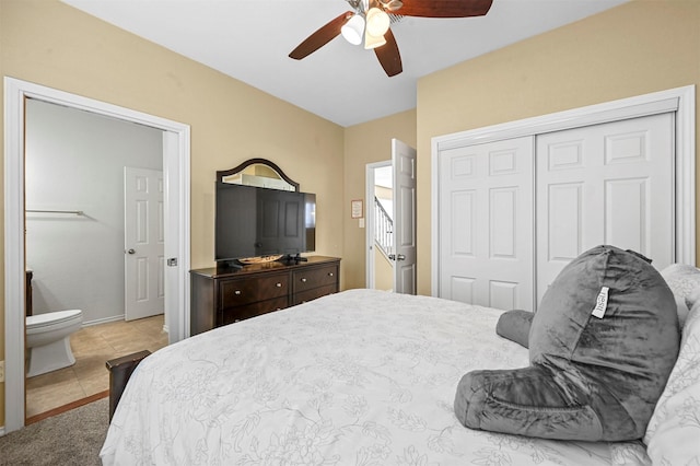 bedroom with ensuite bathroom, a closet, ceiling fan, and light tile patterned flooring