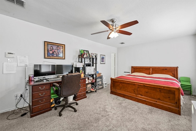 bedroom featuring light carpet and ceiling fan