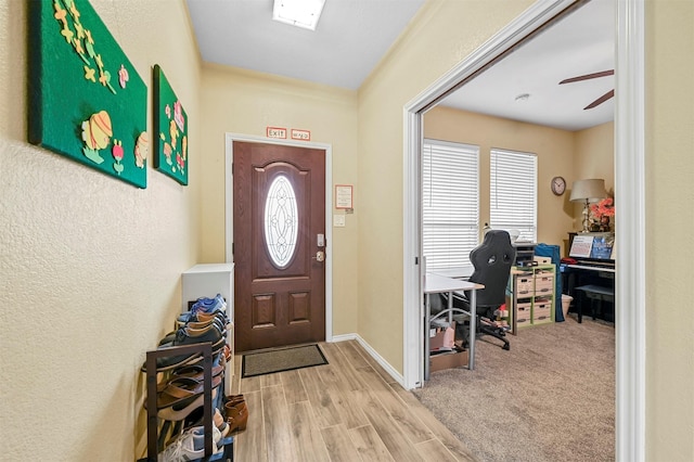 foyer entrance featuring hardwood / wood-style flooring and ceiling fan