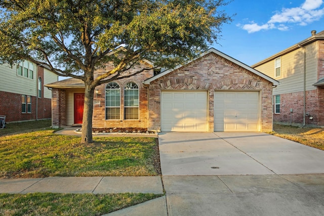 view of front of house with a garage and a front yard