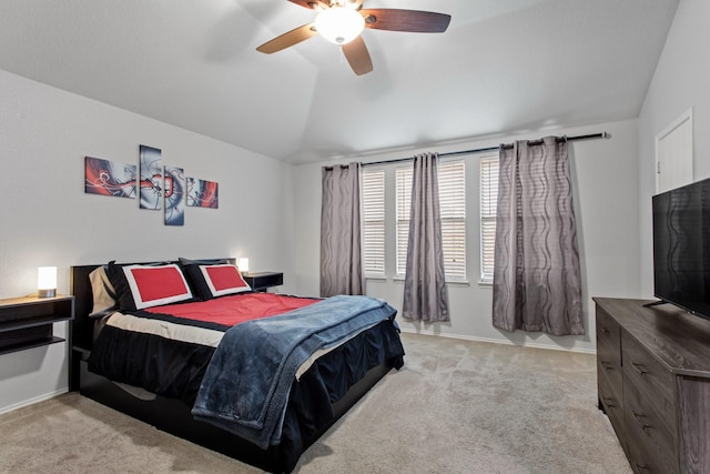 bedroom with lofted ceiling, light colored carpet, and ceiling fan