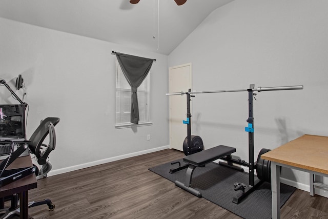 workout room with ceiling fan, dark hardwood / wood-style floors, and vaulted ceiling