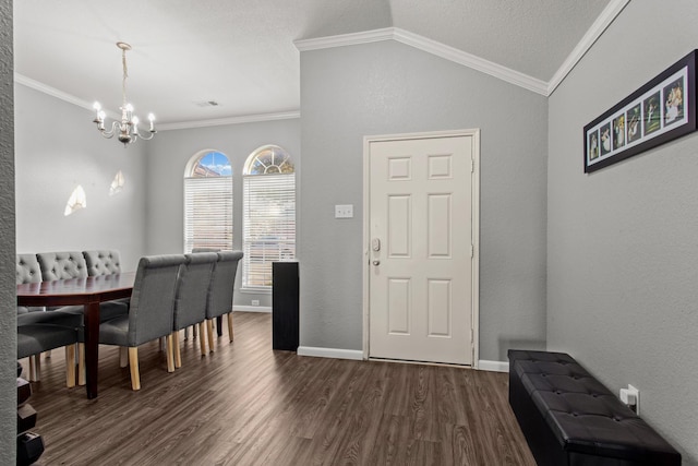 dining space with crown molding, vaulted ceiling, and dark hardwood / wood-style flooring