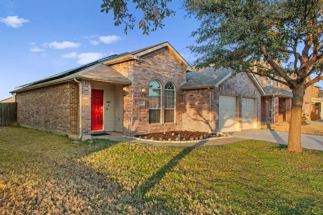 view of front of home with a garage and a front yard