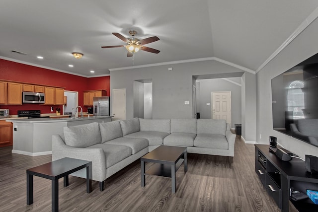 living room with dark wood-type flooring, ceiling fan, crown molding, and vaulted ceiling