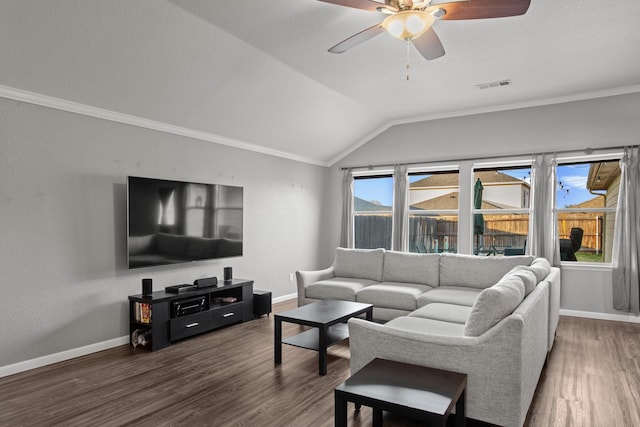 living room with dark hardwood / wood-style flooring, ornamental molding, lofted ceiling, and ceiling fan