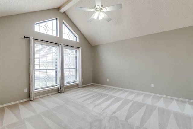 carpeted empty room featuring beamed ceiling, ceiling fan, high vaulted ceiling, and a textured ceiling