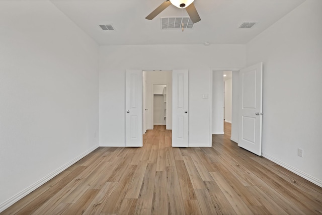 unfurnished bedroom with light hardwood / wood-style flooring and ceiling fan