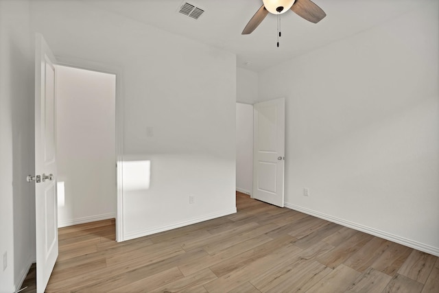 unfurnished room featuring ceiling fan and light hardwood / wood-style flooring