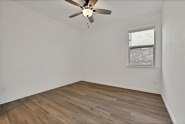 empty room featuring ceiling fan and light wood-type flooring