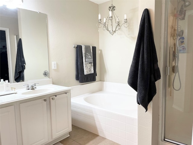 bathroom featuring vanity, a notable chandelier, tile patterned floors, and independent shower and bath