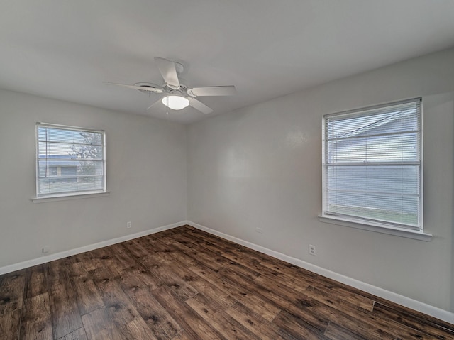 unfurnished room with dark hardwood / wood-style floors and ceiling fan