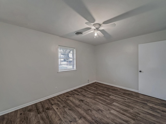 unfurnished room with dark wood-type flooring and ceiling fan