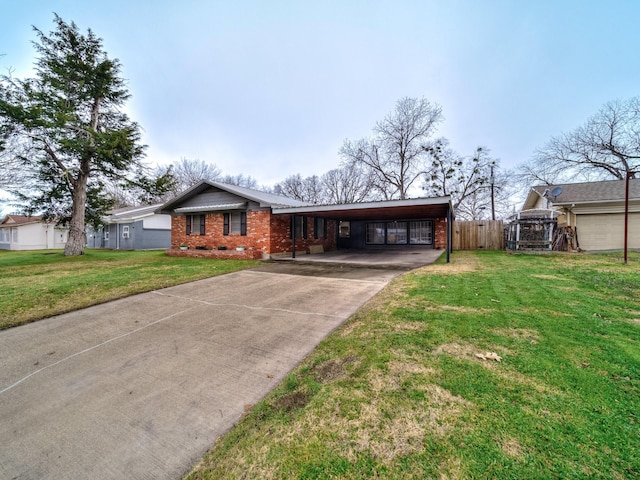 single story home featuring a carport and a front lawn