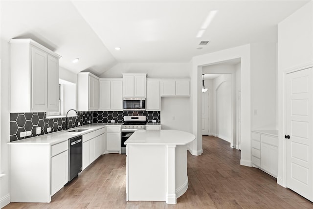 7732 Barley Fld, Joshua, TX 76058 - kitchen featuring stainless steel appliances, a sink, backsplash, white cabinets, and lofted ceiling
