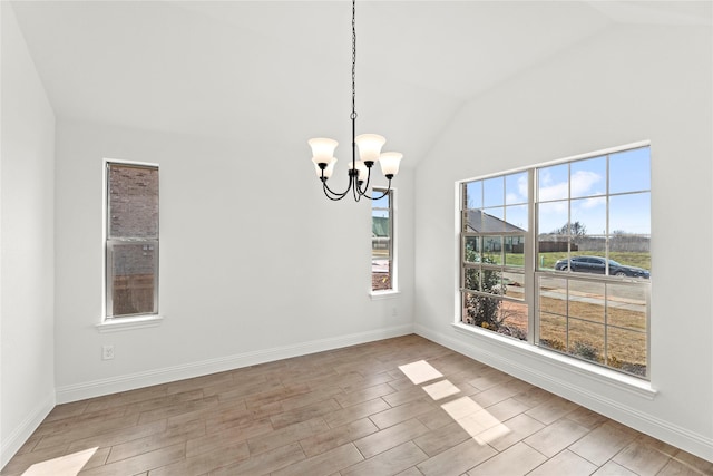 7732 Barley Fld, Joshua, TX 76058 - empty room featuring vaulted ceiling, a chandelier, wood finished floors, and baseboards