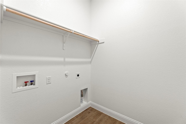 clothes washing area with laundry area, baseboards, dark wood-style flooring, hookup for an electric dryer, and washer hookup