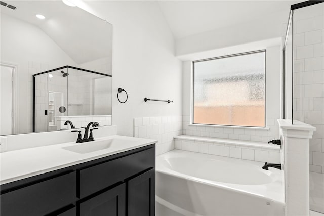 full bathroom featuring lofted ceiling, visible vents, a tile shower, vanity, and a bath