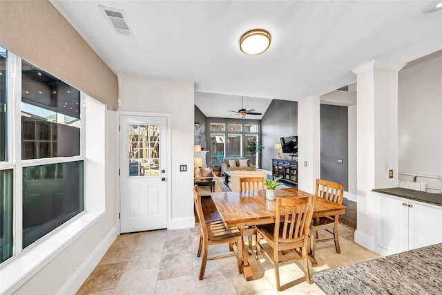 dining room featuring ceiling fan