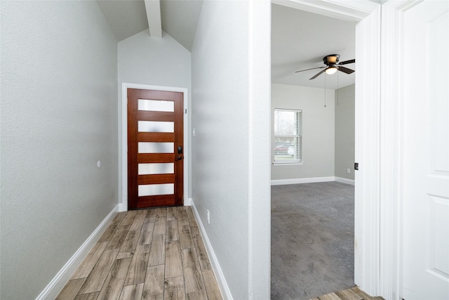 entryway featuring vaulted ceiling with beams, light hardwood / wood-style floors, and ceiling fan